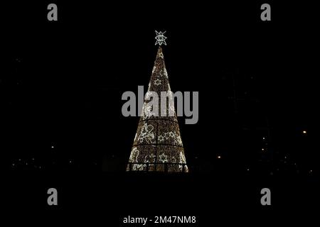 madrid illuminated christmas tree in castilla place isolated on black Stock Photo