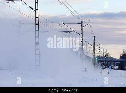 A train passing by in winter time Stock Photo
