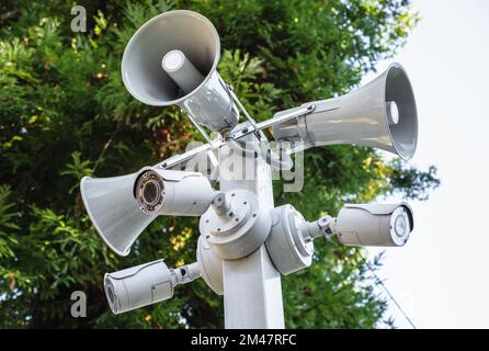 IP CCTV cameras and loudspeakers on pole for public protection and security. Stock Photo