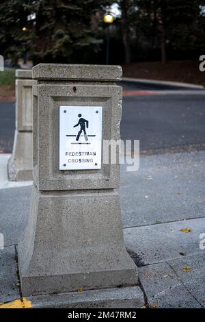 Pedestrian Crossing Caution Sign on a Pillar Stock Photo