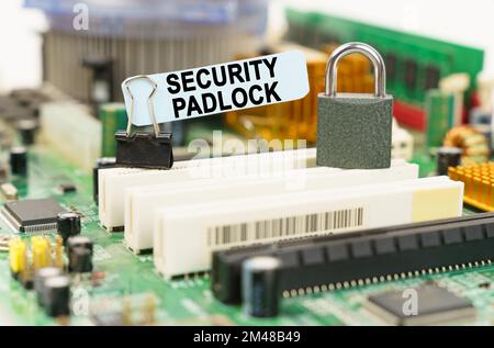 Computer security concept. There is a sticker on the motherboard that says - Security Padlock Stock Photo
