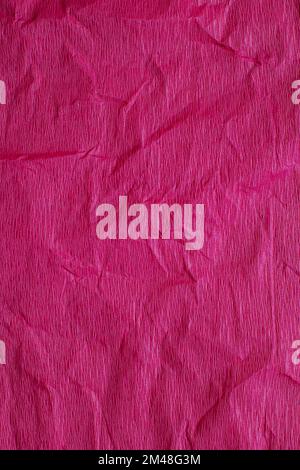 Craft Paper Texture or Background in bright magenta color. Close-up. Stock Photo