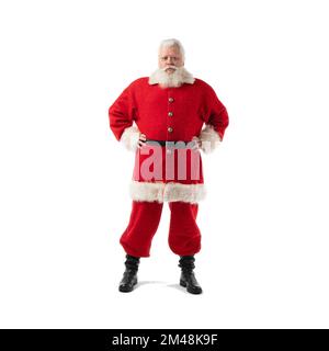 Santa Claus holding his hands on belt, isolated on white background full length portrait. Stock Photo