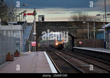 Virgin Trains class 221 voyager train passing New Cumnock,station with a semaphore signal in  southern Scotland  with a diverted Anglo Scottish train Stock Photo