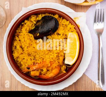 Portion of freshly made paella with seafoods Stock Photo