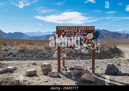 Teakettle Junction is in Death Valley National Park, near the Racetrack Playa, and Ubehebe Crater. At the junction there is a sign reading 'Teakettle Stock Photo