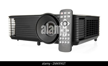 Black video projector with remote control on white background Stock Photo