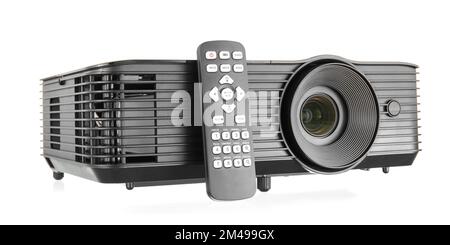 Black video projector with remote control on white background Stock Photo