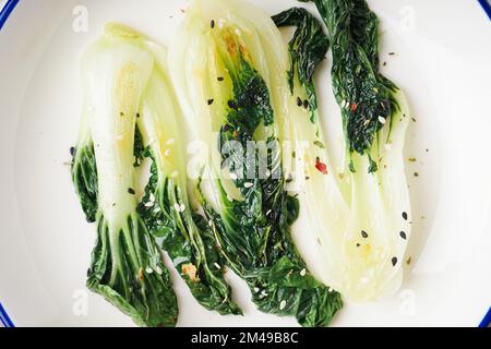 Plate of tasty stewed pak choi cabbage, closeup Stock Photo