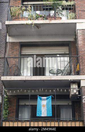 Argentine flag on balcony in Buenos Aires, Argentina during 2022 FIFA World Cup Stock Photo