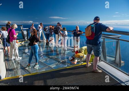 Tourists look at the view from the glass-bottom skywalk, Cabo Girao, Funchal, Madeira Island, Portugal Stock Photo