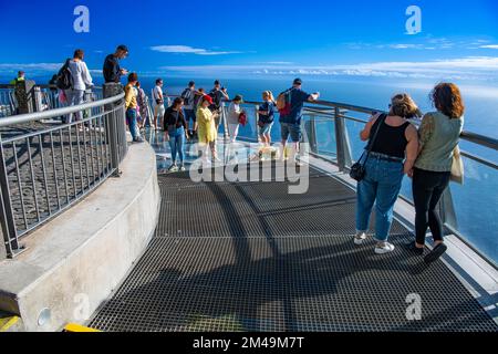Tourists look at the view from the glass-bottom skywalk, Cabo Girao, Funchal, Madeira Island, Portugal Stock Photo