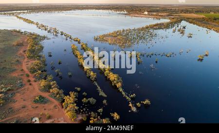 Low altitude aerial picture of riverine flooding at the edge of Wargan reserve, looking towards silos and settlement of Yelta, northwestern Victoria, Stock Photo