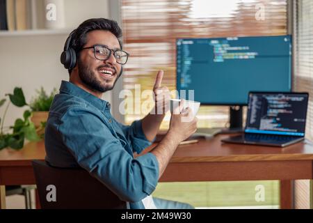 Male freelancer making new project as web designer or programmer on his computer at home office Stock Photo