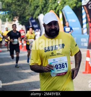 New Delhi, India - October 16 2022 - Vedanta Delhi Half Marathon race after covid in which marathon participants about to cross the finish line, Delhi Stock Photo