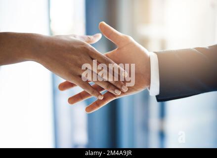 When opportunity presents itself to you, grab it. Closeup shot of two unrecognizable businesspeople shaking hands in an office. Stock Photo