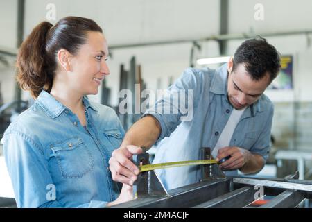 two worker on work bench in the factory Stock Photo