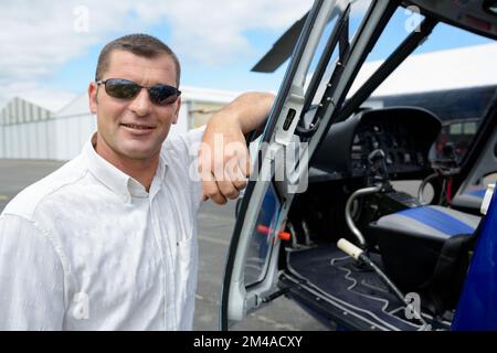 pilot and co pilot in cockpit of helicopter Stock Photo