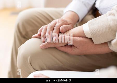 Senior Chinese couple holding hands Stock Photo