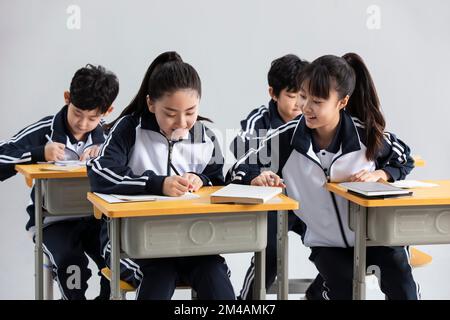 Chinese students learning in classroom Stock Photo