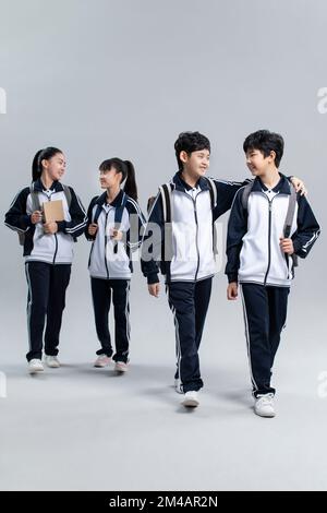 Studio shot of cheerful Chinese students Stock Photo