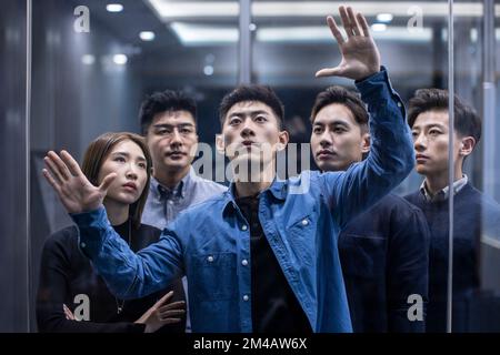 Confident Chinese designers working together Stock Photo