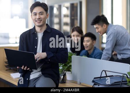 Portrait of Chinese IT worker in office Stock Photo