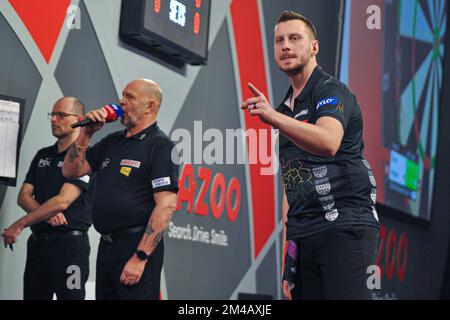 LONDON, UNITED KINGDOM - DECEMBER 16: Florian Hempel of Germany reacts during his First Round match at the 2022/23 Cazoo World Darts Championship at Alexandra Palace on December 16, 2022 in London, United Kingdom. (Photo by Pieter Verbeek/BSR Agency) Stock Photo