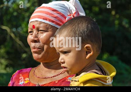 Raising kids in tribal villages is done by the whole family Stock Photo