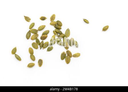 Isolated pumpkin seeds on white background, close-up pumpkin seeds, top view image. Stock Photo
