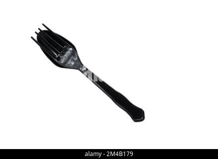 Isolated black plastic spoon and fork on white background, takeaway utensil spoon and fork, top view image. Stock Photo
