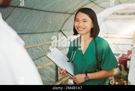 Vet, animal health and woman with checklist for bird flu symptoms and agriculture on chicken farm. Poultry farming, veterinary and doctor with Stock Photo
