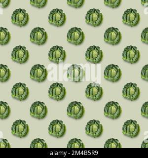 Fresh white cabbage seamless pattern  on green background. Diet and vegetarian food. Top view. Stock Photo