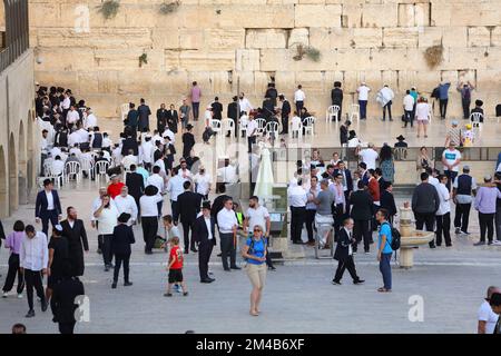 JERUSALEM, ISRAEL - OCTOBER 29, 2022: People visit the Western Wall (or Wailing Wall) in Jerusalem Old City. It is part of Jerusalem's UNESCO World He