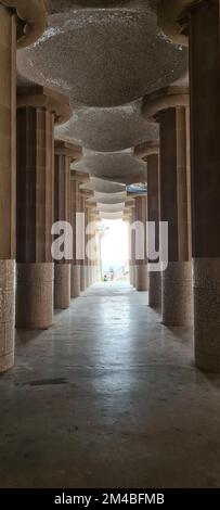 A vertical shot of the Hypostyle Room in the famous Park Guell in the city of Barcelona Stock Photo