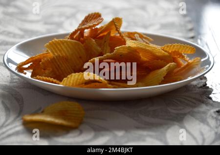 Potato chips in a plate. Stock picture. Stock Photo