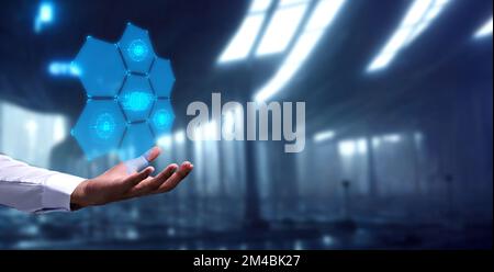 A futuristic wallpaper of a man holding a floating AI figure Stock Photo