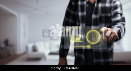 A man clicking on cryptocurrency logo - trading cryptocurrency concept Stock Photo