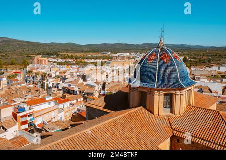 a birds eye view of Alcala de Xivert, in the Valencian Community, Spain, highlighting the dome of the San Juan Bautista Church, covered with blue cera Stock Photo