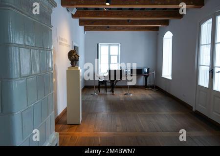 Room where Frederic Chopin was born in Birthplace of Chopin in Żelazowa Wola, Poland with bronze sculpture of composer head by Xavery Dunikowski Stock Photo