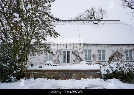 The Birthplace of Fryderyk Chopin (traditional Polish manor-house) and Park in Żelazowa Wola (Poland) is covered by snow. Museum is open for tourists. Stock Photo