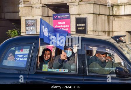 London, England, UK. 20th Dec, 2022. RCN members holding a flag and placards pass by in a taxi. Nurses and Royal College of Nursing members staged a demonstration at the picket line outside St Thomas' Hospital on the second day of the first UK nurse strike in NHS history. Thousands of nurses across the country are on strike in a dispute over pay. (Credit Image: © Vuk Valcic/ZUMA Press Wire) Stock Photo