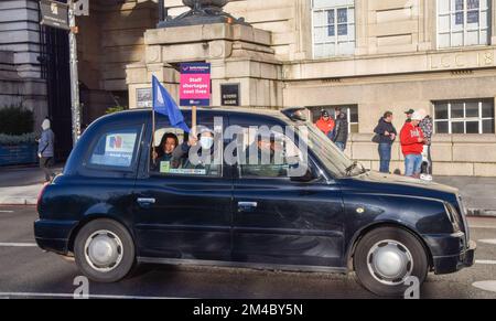 London, England, UK. 20th Dec, 2022. RCN members holding a flag and placards pass by in a taxi. Nurses and Royal College of Nursing members staged a demonstration at the picket line outside St Thomas' Hospital on the second day of the first UK nurse strike in NHS history. Thousands of nurses across the country are on strike in a dispute over pay. (Credit Image: © Vuk Valcic/ZUMA Press Wire) Stock Photo