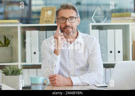 Leadership, ceo or senior businessman thinking of future project ideas, vision or sales goals mission target at office desk. Face, portrait or Stock Photo