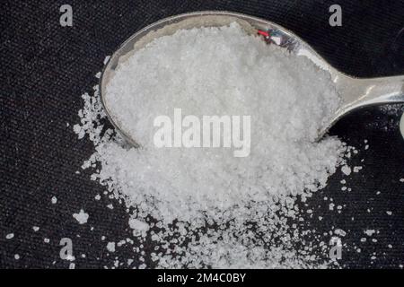White refined sugar on a spoon Stock Photo