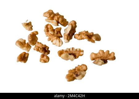 flying walnut kernels. Walnut kernels peeled isolated on white background Stock Photo
