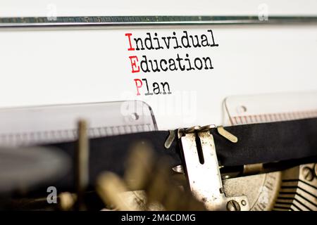 IEP individual education plan symbol. Concept words IEP individual education plan typed on old retro typewriter. Beautiful white background. Business Stock Photo