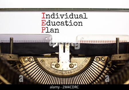 IEP individual education plan symbol. Concept words IEP individual education plan typed on old retro typewriter. Beautiful white background. Business Stock Photo