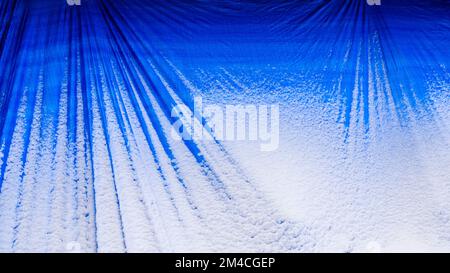 A blue tarp, dusting of snow, Greater Sudbury, Ontario, Canada Stock Photo