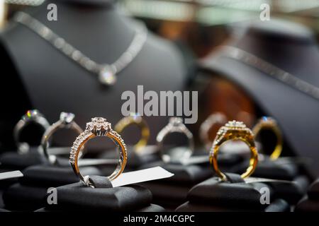 Jewelry diamond rings and necklaces show in luxury retail store window ...